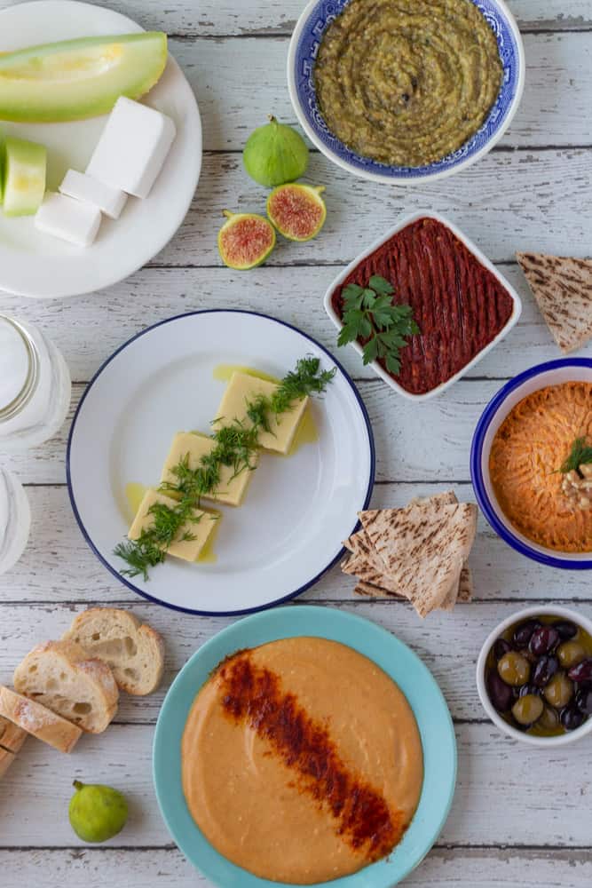 Turkish Roasted Eggplant Dip and mezze spread on white table