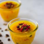 turmeric rice pudding zerde in bowls on marble backdrop