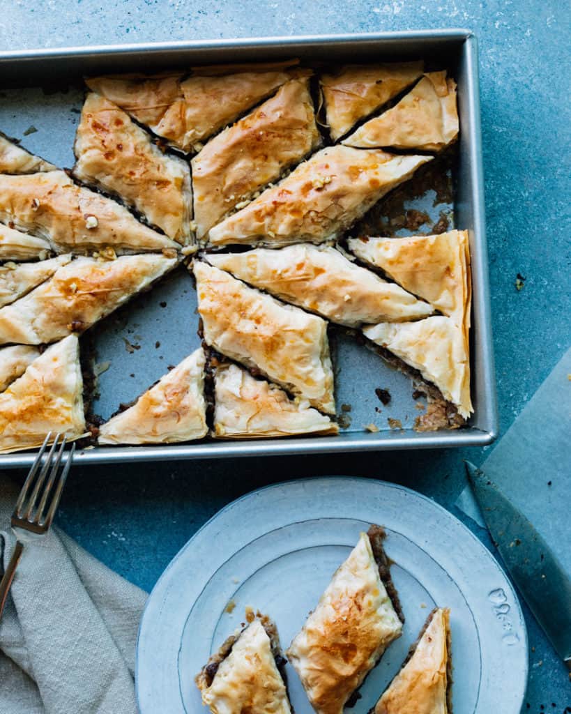 Who doesn't love this Mediterranean/Middle Eastern treasure? Vegan baklava is actually extremely simple to make with store-bought phyllo dough! Step-by-step video instructions are available.