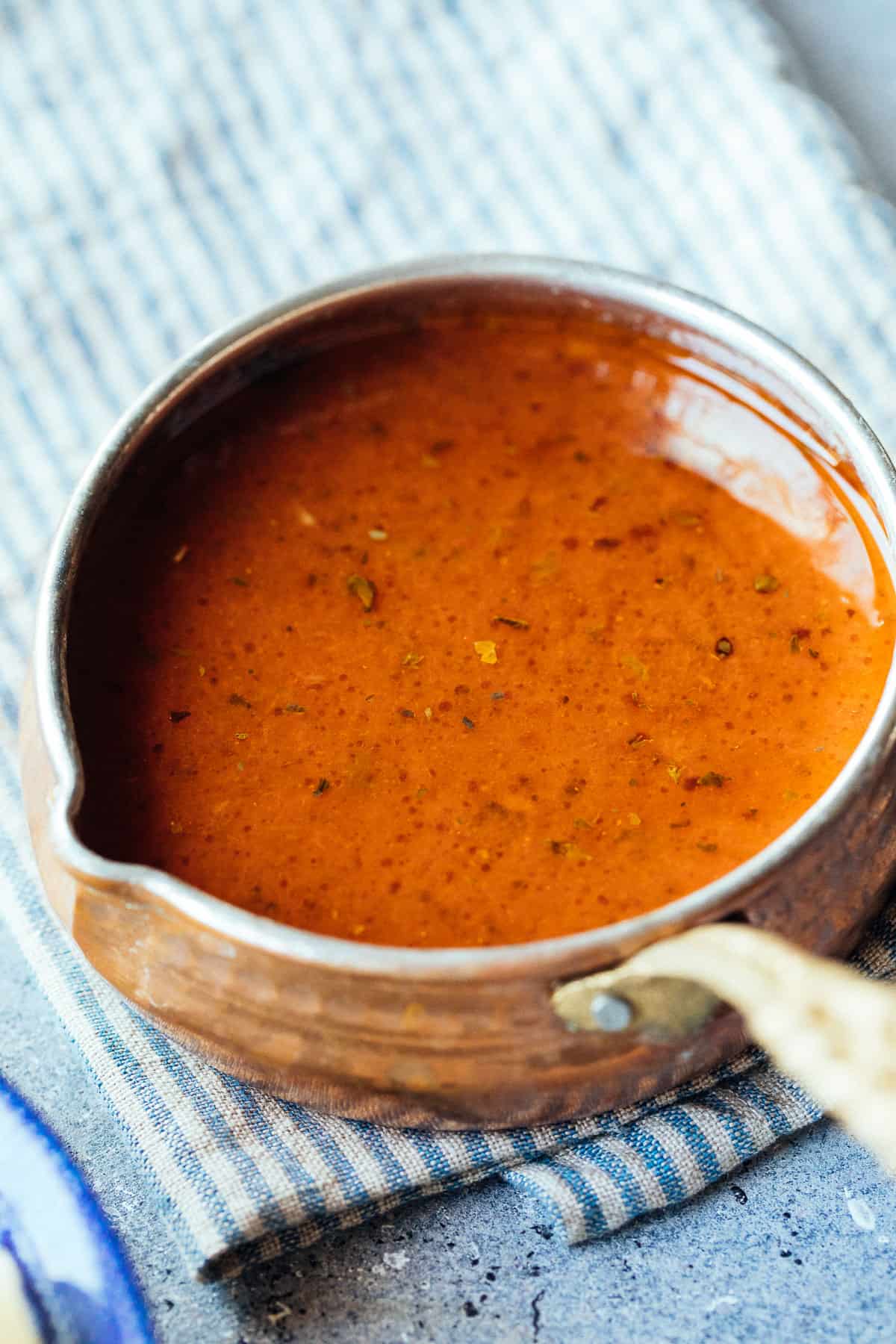 tomato paste pasta sauce in a decorative Turkish copper pot