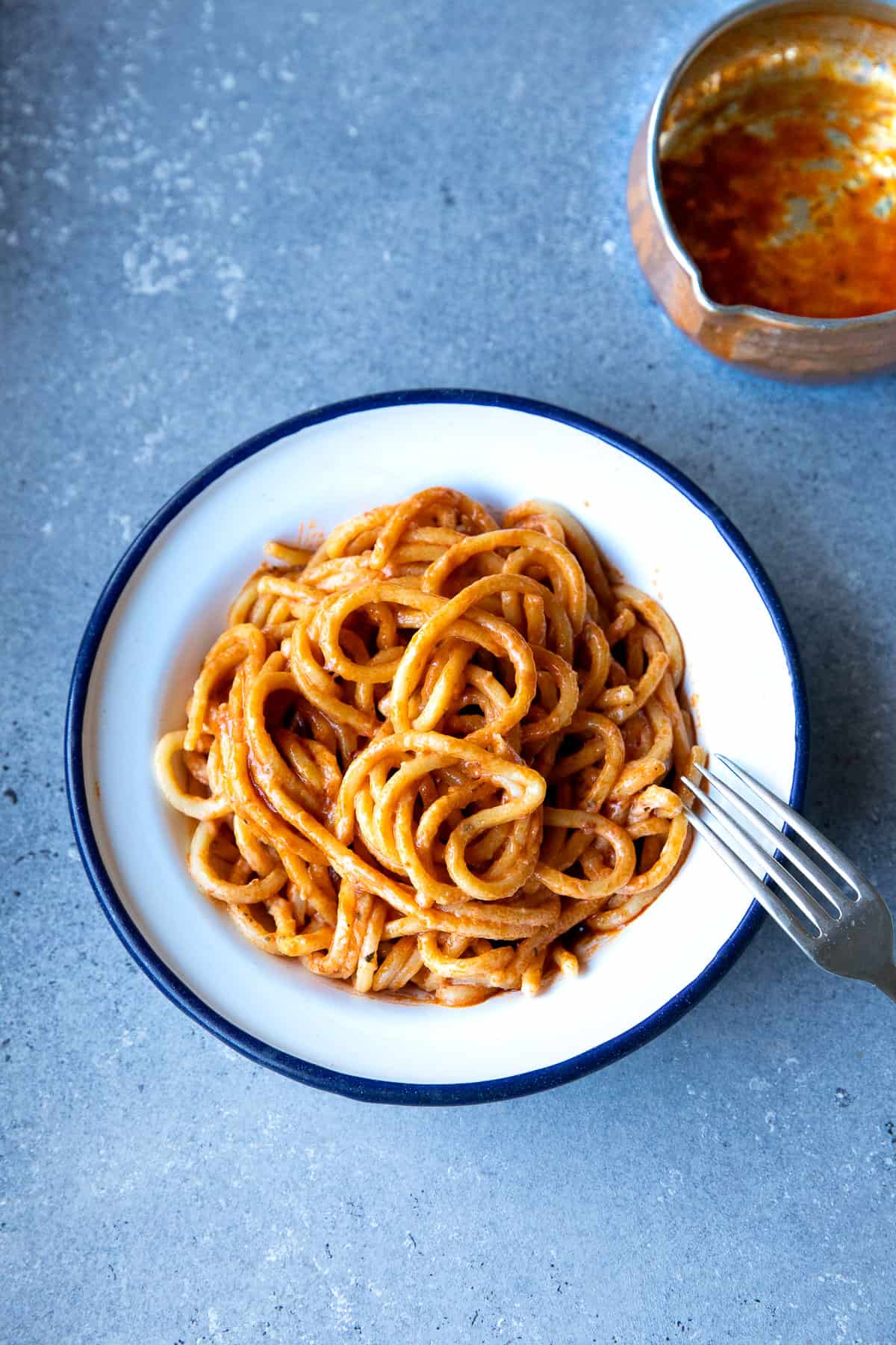 pasta with tomato paste sauce on a plate