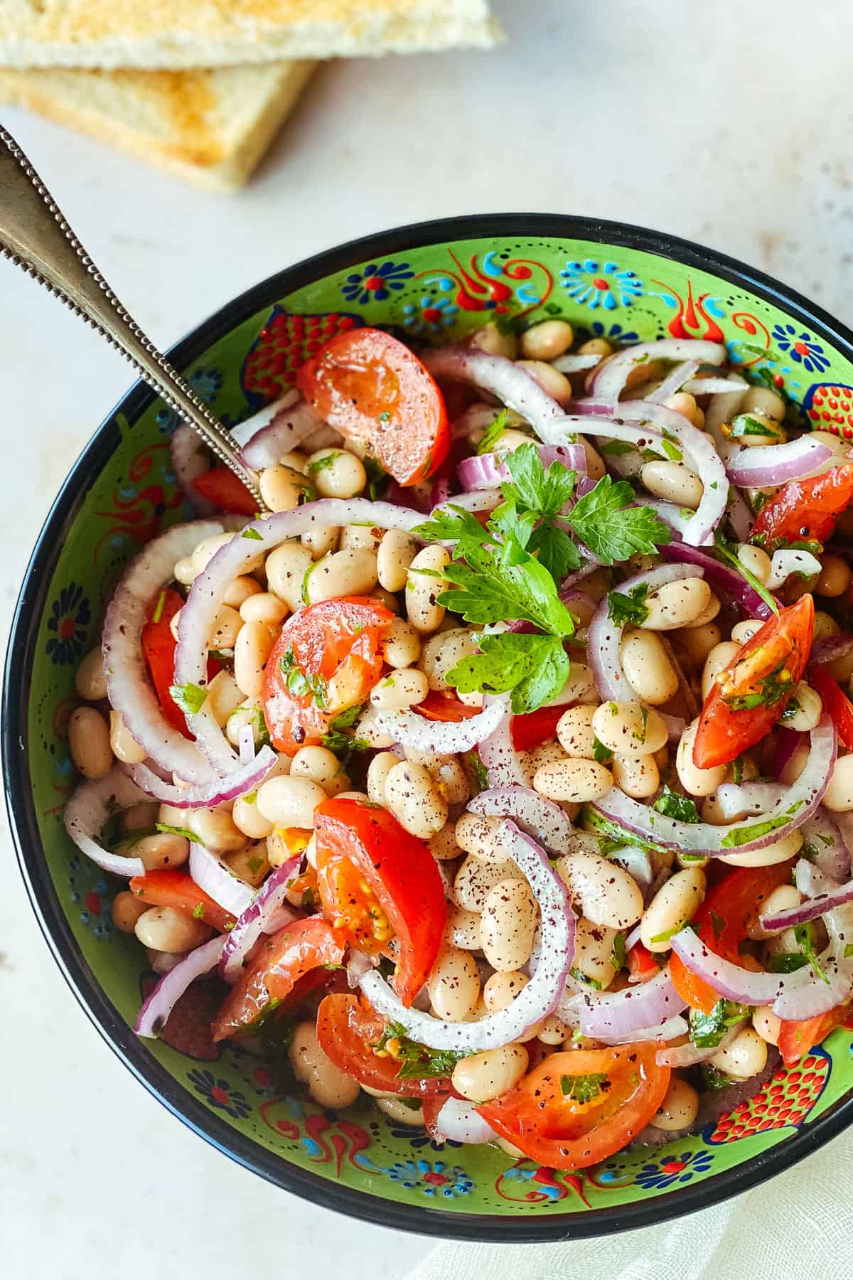 Mediterranean Bean Salad in decorative green bowl