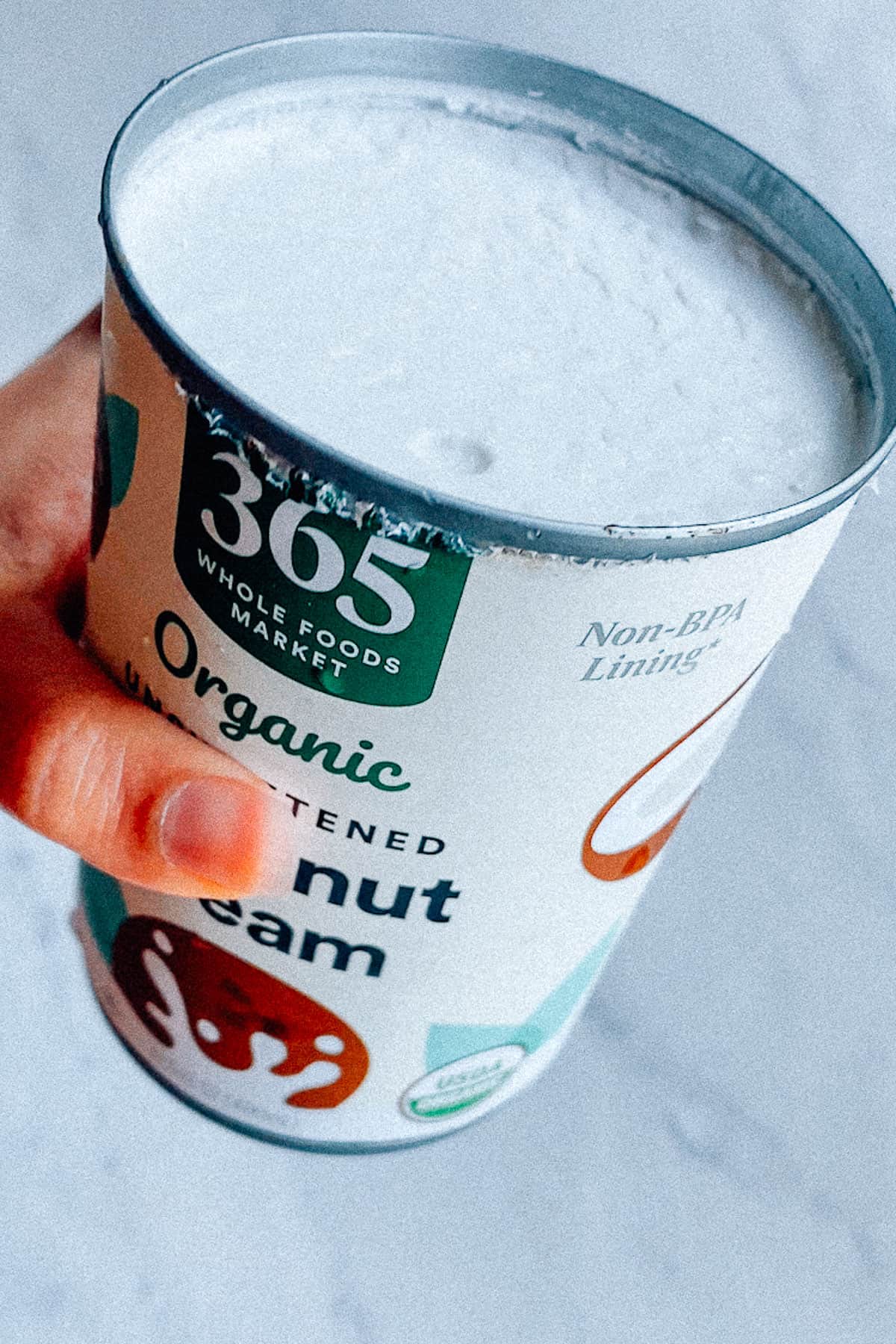 a newly opened can of coconut cream