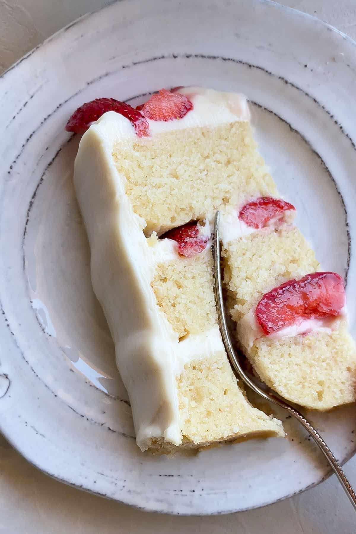 slice of vegan vanilla cake on a plate