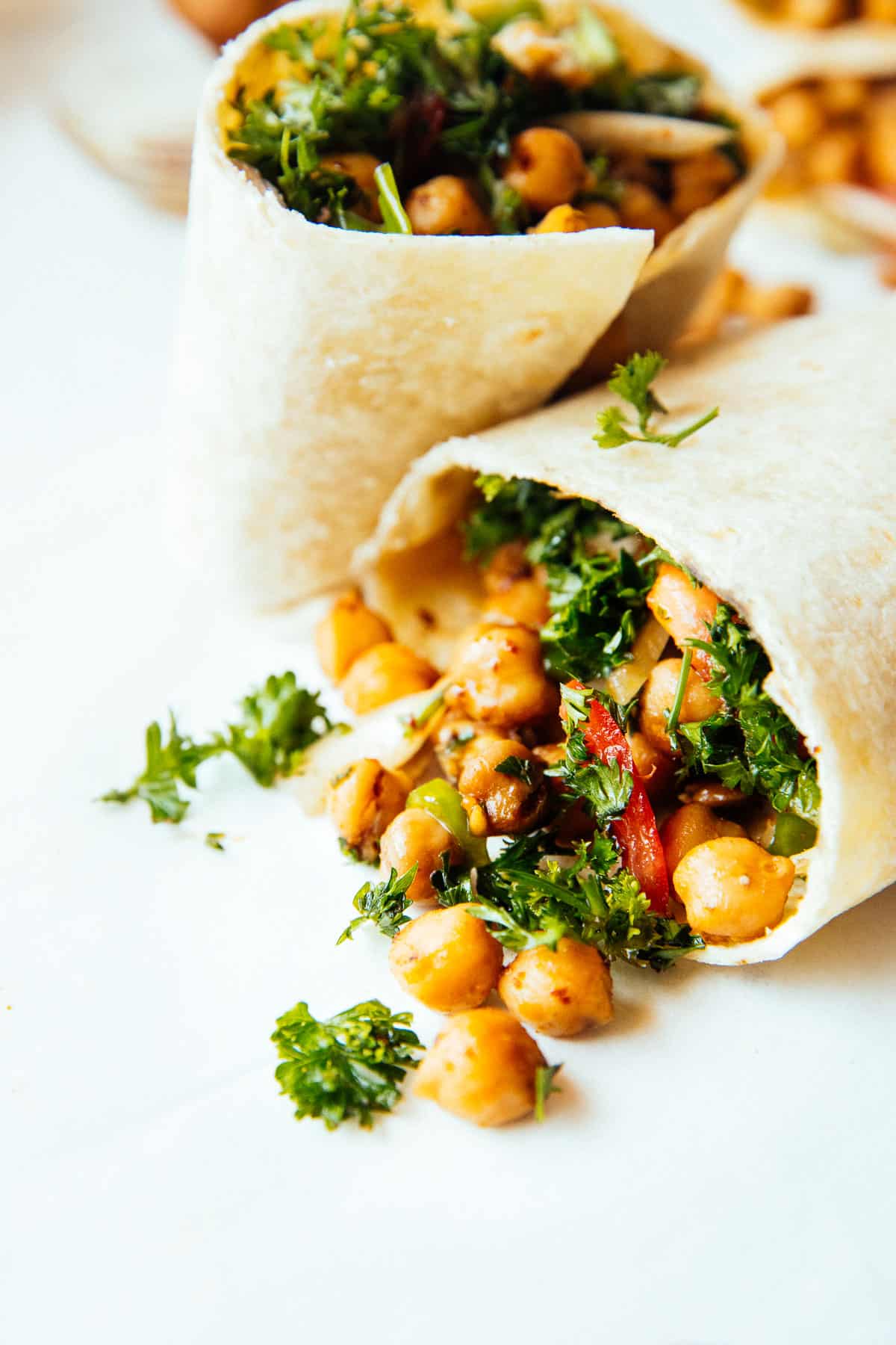 chickpeas spilling out from wrap