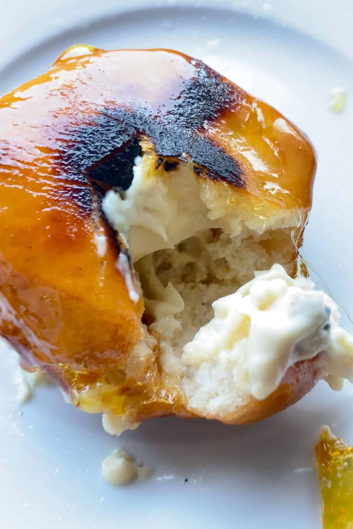 vegan crème brûlée doughnut that's been torched and cut into