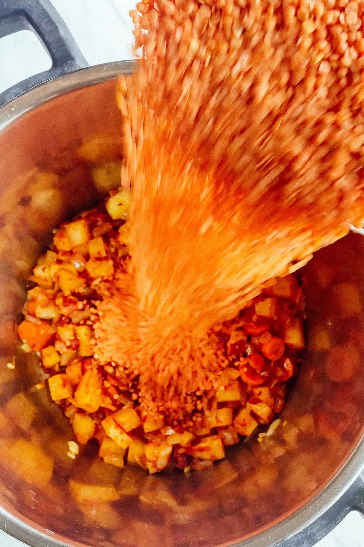 lentils being poured into pot