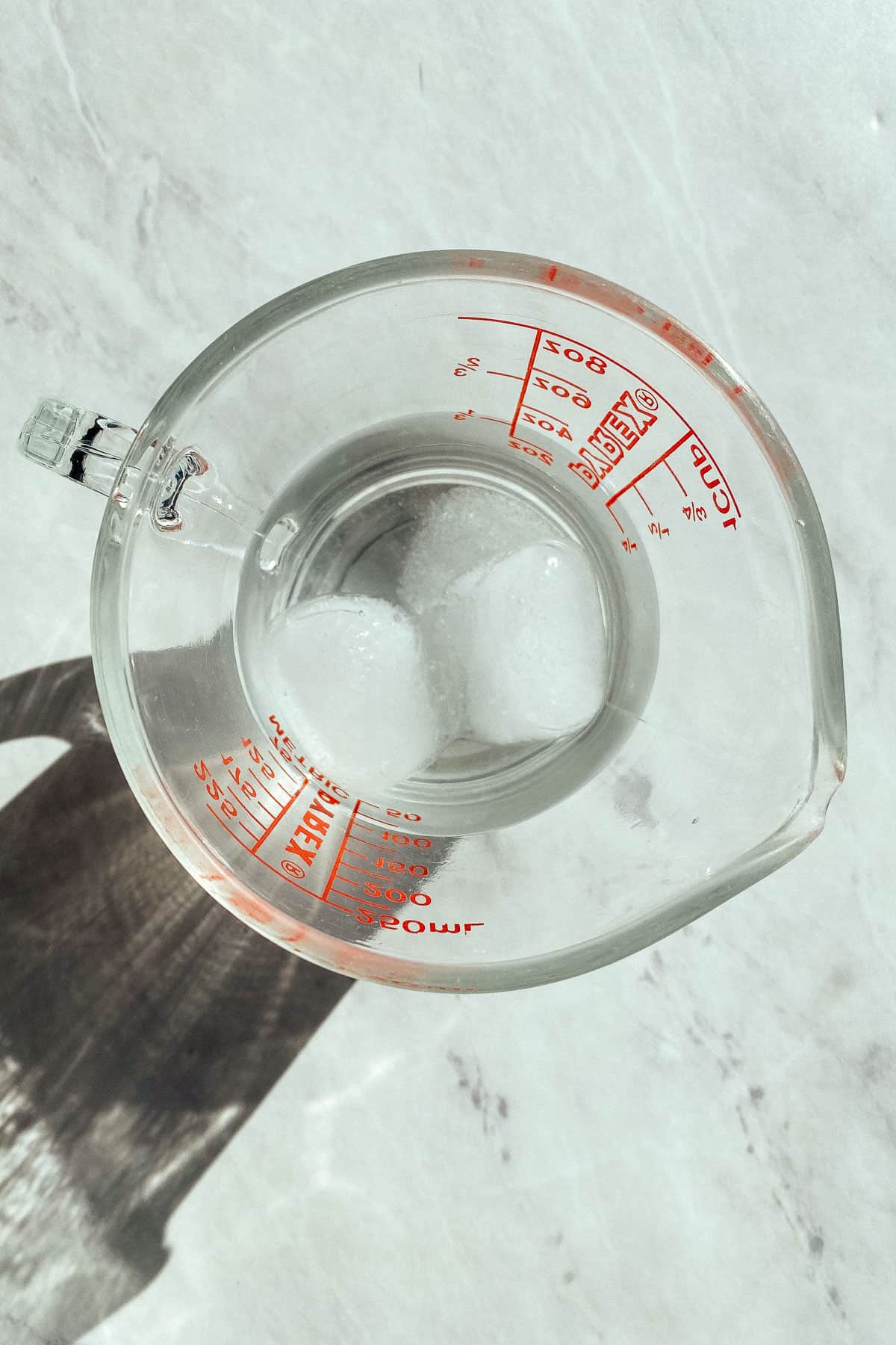 icy water and salt in a measuring cup