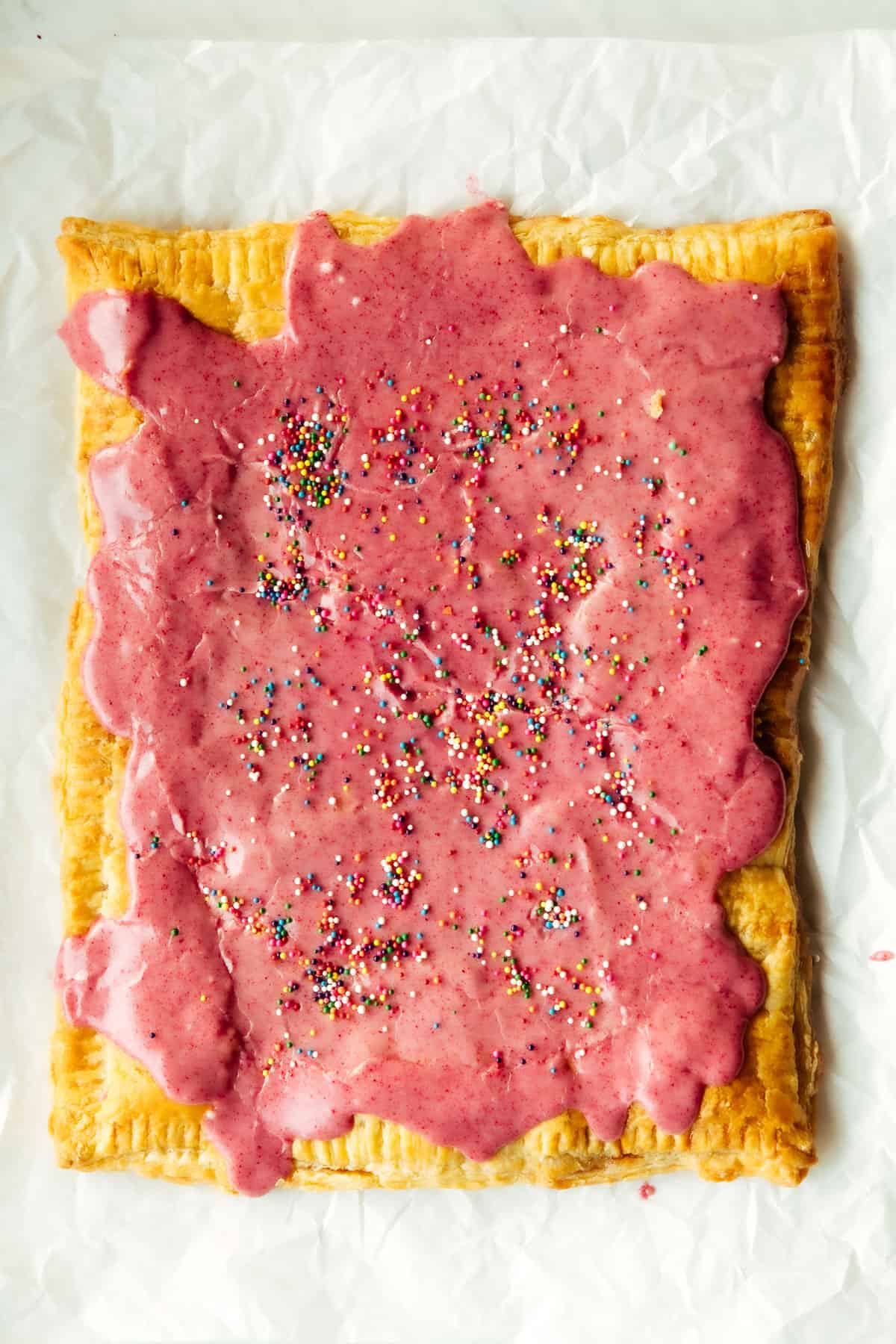 vegan giant frosted pop tart on parchment paper