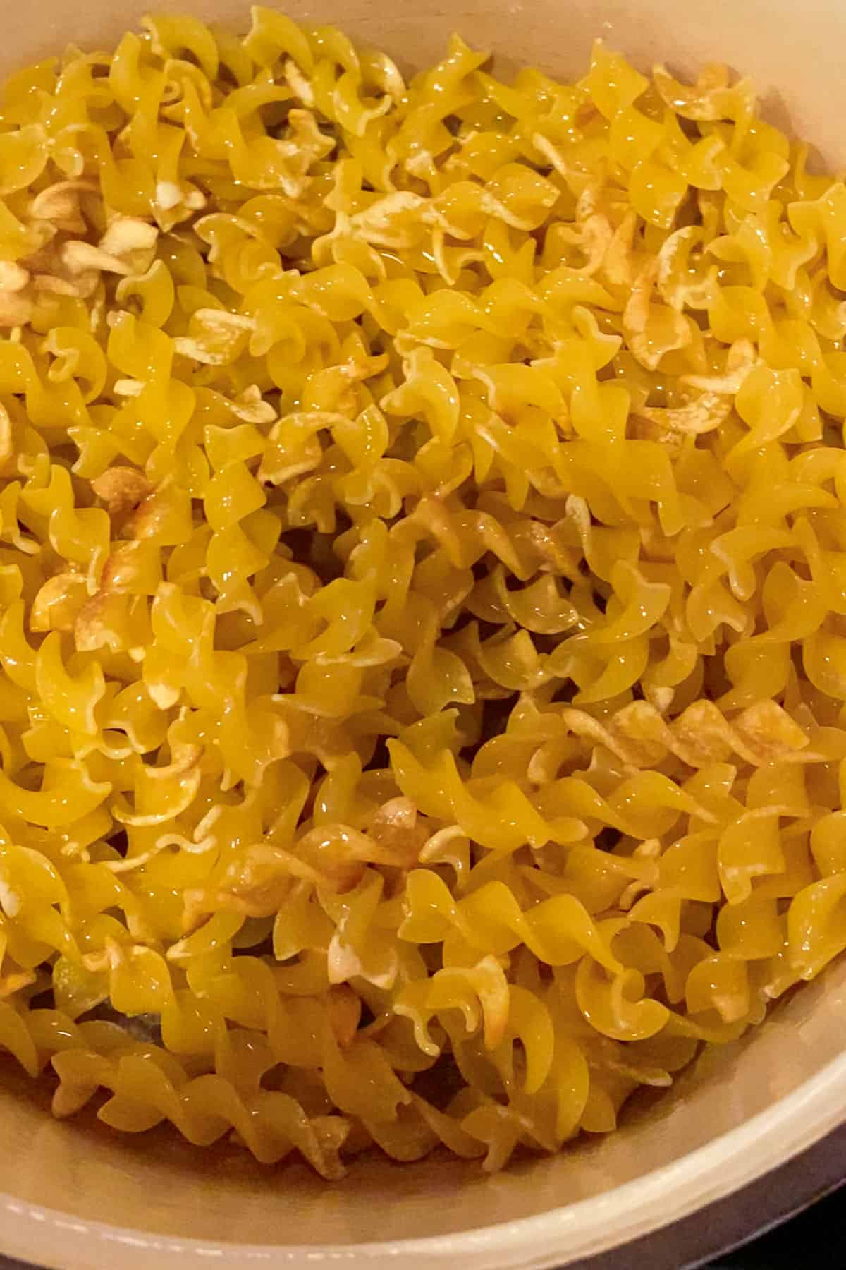 process of toasting Fusilli pasta